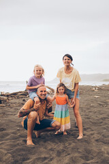 happy family smiling on the beach