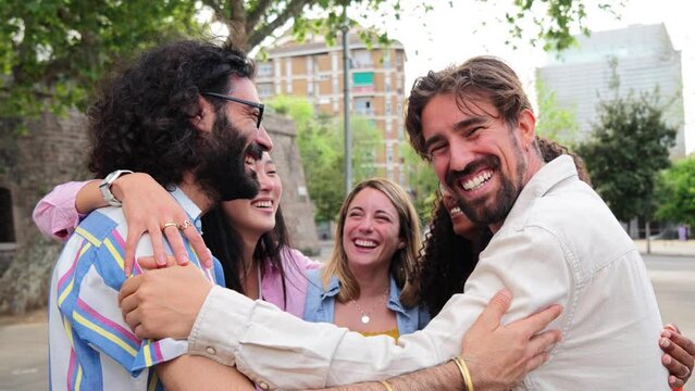 Group of young adult multiracial people having fun together hugging each others. Joyful happy man similing looking at camera and embrace his friends in a circle. Union of a cheerful and Generative AI