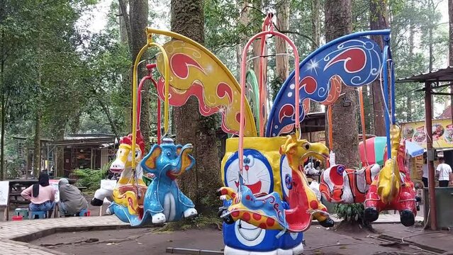 Empty carousel with horses or merry-go-round for children, amusement park, A traditional fairground carousel.