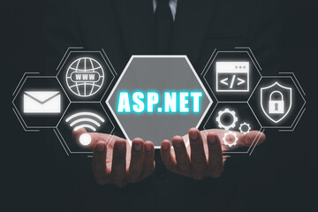 ASP.NET Development programming language concept, Person hand holding ASP.NET icon on virtual screen.