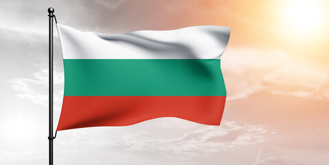Bulgaria national flag cloth fabric waving on beautiful sky grey Background.