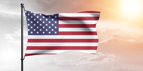 United States national flag cloth fabric waving on beautiful sky grey Background.