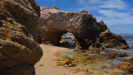 Fototapeta na wymiar Rock arch on beach in Los Cabos, Mexico