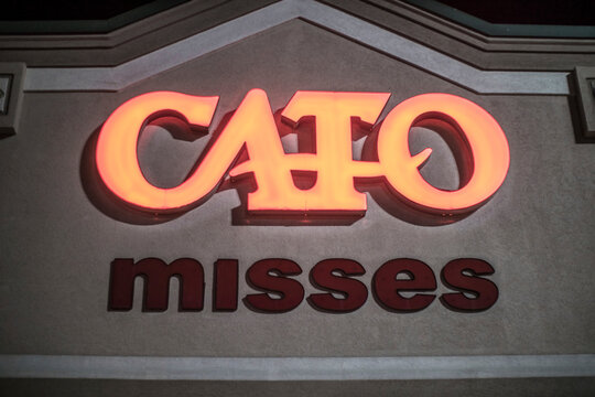 Cato retail store misses store front building sign at night
