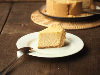 a piece of classic cheesecake on white plate
