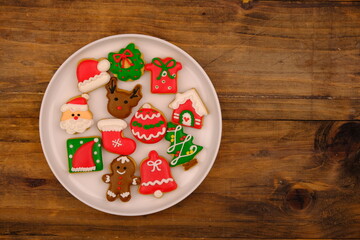 tasty Christmas cookies on a white ceramic plate. delicious colorful Christmas cookies