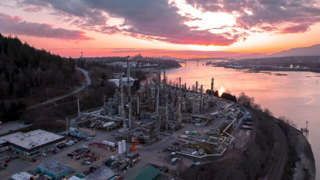Oil refinery aerial view, hyper lapse, distillation tower, gas production, smoke stack, near Vancouver, Canada. 4K 24FPS PRORES 422