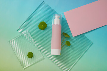 Ribbed acrylic sheet with a pump bottle in pink color placed on. Container packaging of skin care branding. Gotu kola (Centella asiatica) can reduce redness