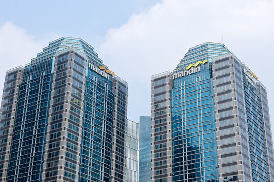 Exterior view of the building and logo of the state-owned enterprise Mandiri Bank in Sudirman Central Business District (SCBD). Jakarta - Indonesia, 06 13 2021