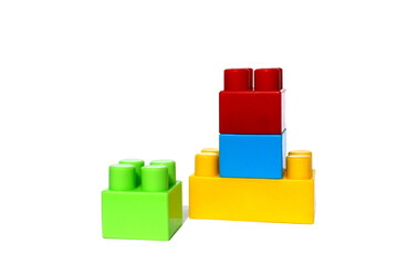 A pile of children's bright toy constructor on a white isolated background.