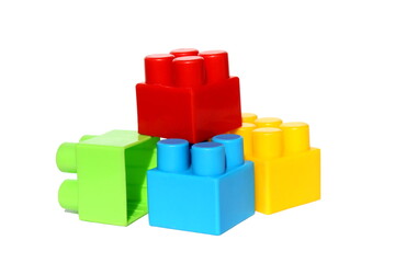 A pile of children's bright toy constructor on a white isolated background.	