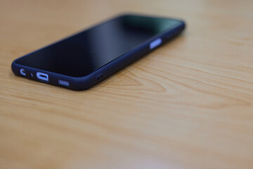 smartphone on the table, blurry, beautiful background