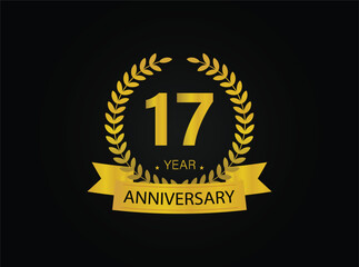 17th years golden anniversary logo celebration with ring and ribbon.
