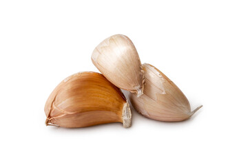 Fresh three garlic cloves in stack isolated on white background with clipping path