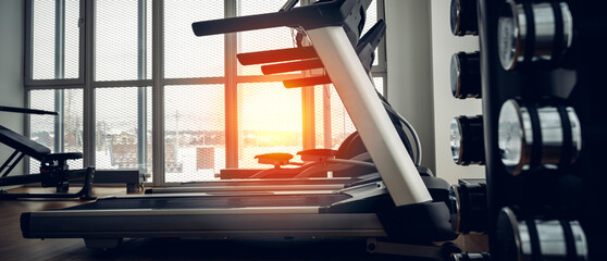 gym with treadmills in the sunlight