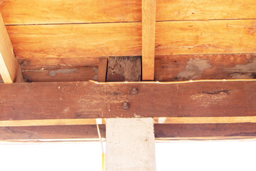 Under nut structure to fix concrete column to large wooden brown beam. Construction of rural houses...