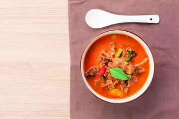 Beef curry, beef panang recipe. Thai food, young coconut milk curry Placed on a wooden table - top view