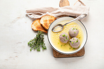 Knodel soup bowl and bread.