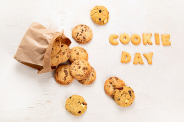 National Cookie Day with yummy freshly chocolate chip cookies on a white background. Top view.