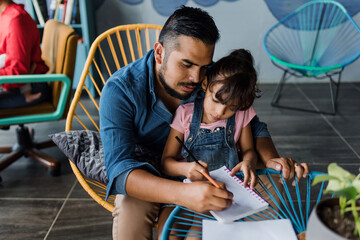 latin father with child daughter doing homework or drawing and painting at home in Mexico Latin America, hispanic family - Powered by Adobe