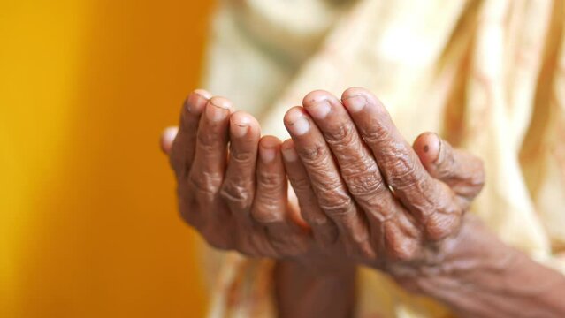 Close up of senior women hand praying at ramadan  Generative AI