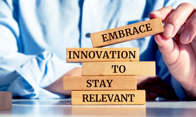 Close up on businessman holding a wooden block with the 