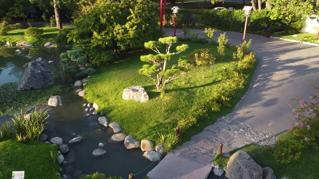 Details of Japanese garden at dusk, Buenos Aires city in Argentina. Aerial drone orbiting at low altitude