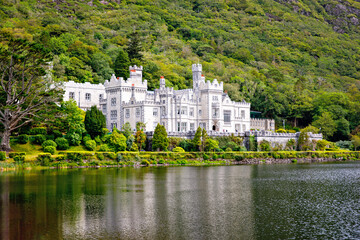 Kylemore Abbey with water reflections in Connemara, County Galway, Ireland, Europe. Benedictine...