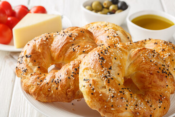Traditional acma Turkish bread buns Freshly baked homemade pastry closeup on the plate on the table. Horizontal