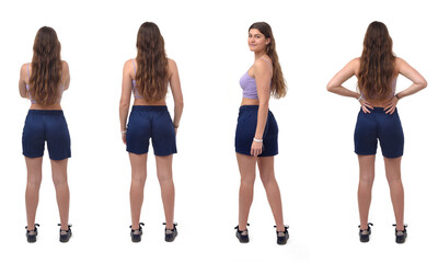 Fototapeta premium back view of a group of same young girl standing and turned and looking at camera on white background