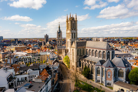 View of St Nicholas' Church in Ghent and Saint Bavo Cathedral, Belgium travel and landmarks from above.