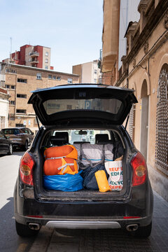 Boot full of stuff for travelling and camping. sleeping bags, tent, kitchen utensils, bags of clothes, ready for holidays.