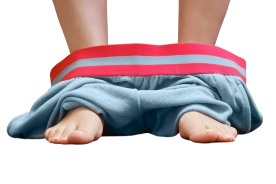 Women legs with their red pants down on the floor in the toilet, bottom view, isolated on a white background. Brown marble background, concept diarrhea, copy space