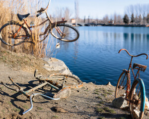 Rusty metal junk bicycles collected from river, The image captures the intriguing sight of...