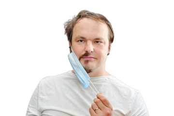 The man removes the medical mask under which the half-shaved beard and disheveled hair, isolated on a white background. The concept of closed salons and barbershop during the isolation of coronavirus
