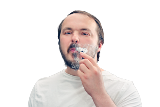 Adult man shaves his beard on his own, lifestyle, isolated on a white background. Concept of recovery and return to normal life after the coronavirus epidemic