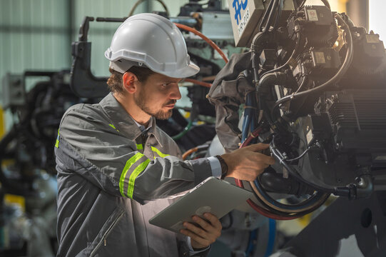 Man Engineer Technician Mechanical Worker Inspection Check Heavy Machine In Industrial Factory By Tablet. Technician Engineer Worker Check For Maintenance And Repair Factory Machine Equipment.