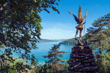 Saint Michael defeats Satan. sculpture at Duingt in Annecy lake area