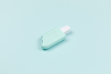 closeup of a popsicle on cyan surface icecream