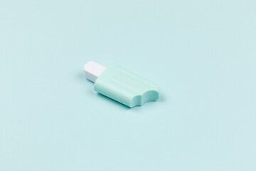 closeup of a popsicle on cyan surface icecream