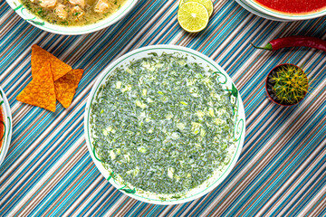 Traditional mexican food. Cold okroshka soup. Colorful Food Table Celebration Delicious Party Meal Concept. 