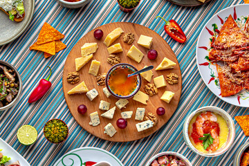 Traditional mexican food. Cheese plateau. Colorful Food Table Celebration Delicious Party Meal Concept. 
