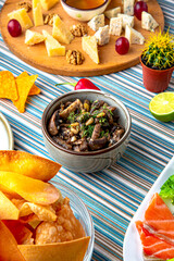 Traditional mexican food. Fried mushrooms and cedar nuts. Colorful Food Table Celebration Delicious Party Meal Concept. 