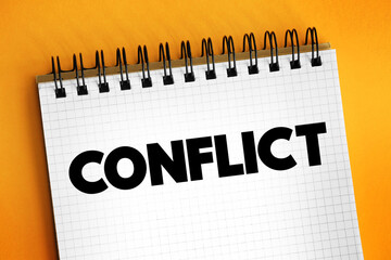 Conflict - struggle and a clash of interest, opinion, or even principles, text concept on notepad