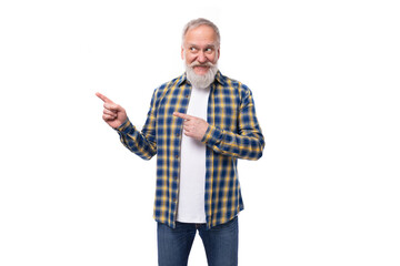 mature gray-haired retired man with a mustache and beard shows with his hands for the presence of a strategy on a white background