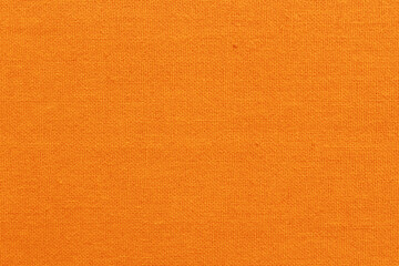 Orange cotton fabric cloth texture for background, natural textile pattern.