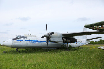 Fototapeta na wymiar abandoned damaged russian military airplane Antonov An-24
