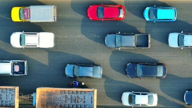 During peak hours, highway traffic can become congested, resulting in slower speeds and increased travel times. This congestion often occurs near urban areas or at interchange points. Aerial view
