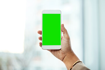 The smarter way of saying hello. an unrecognizable businesswoman using a mobile phone in her office.