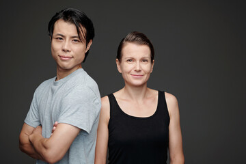 Fototapeta premium Studio portrait of happy man and woman in casual clothes looking at camera